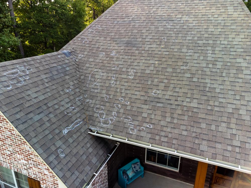 Repairing Noblesville Roof Hail Damage can prevent more serious issues image shows roof marked for hail damage spots