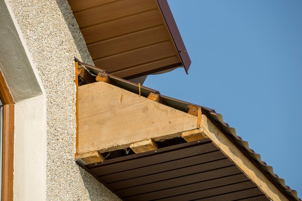 Work with the experienced Beard Roofing team for Zionsville Residential Damage image show construction on corner of building