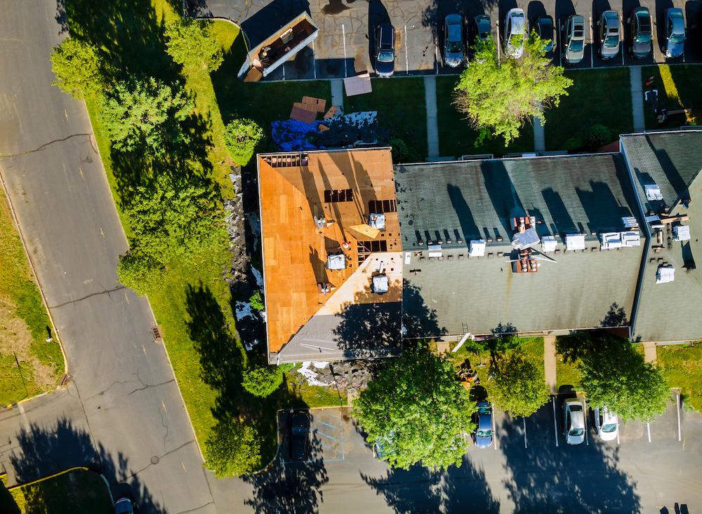 Schedule an inspection for Carmel Roof Replacement with Beard Roofing image shows roof being replaced