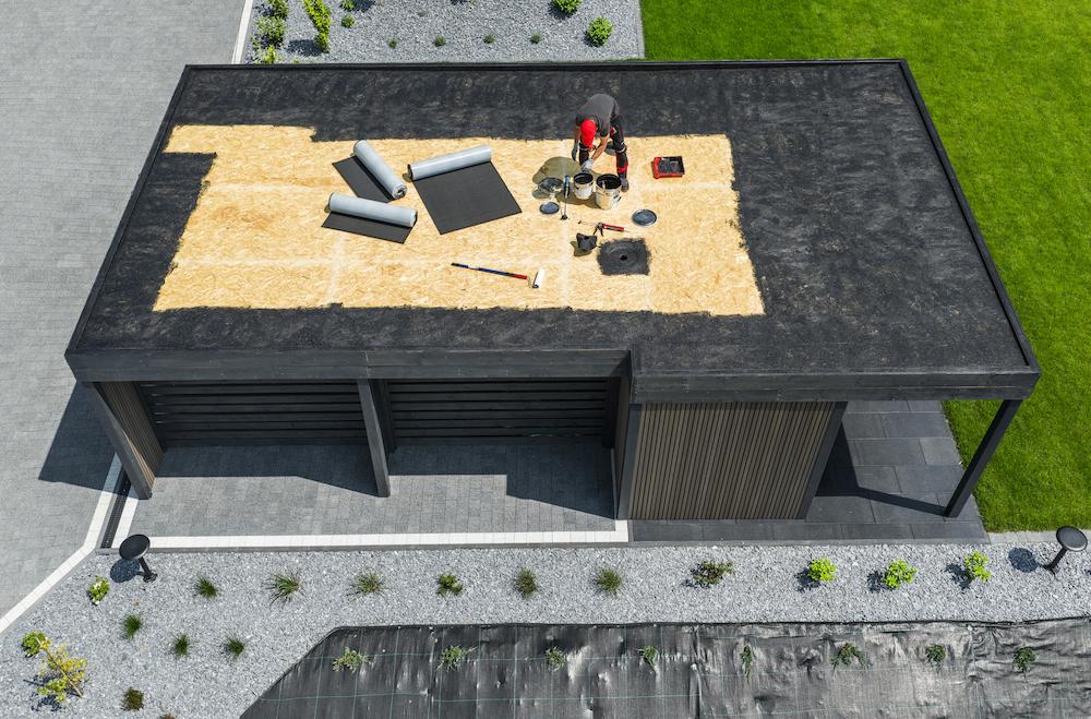 Work with the capable Beard Roofing & Exteriors team for Carmel Flat Roof Replacement image shows work in progress on flat roof