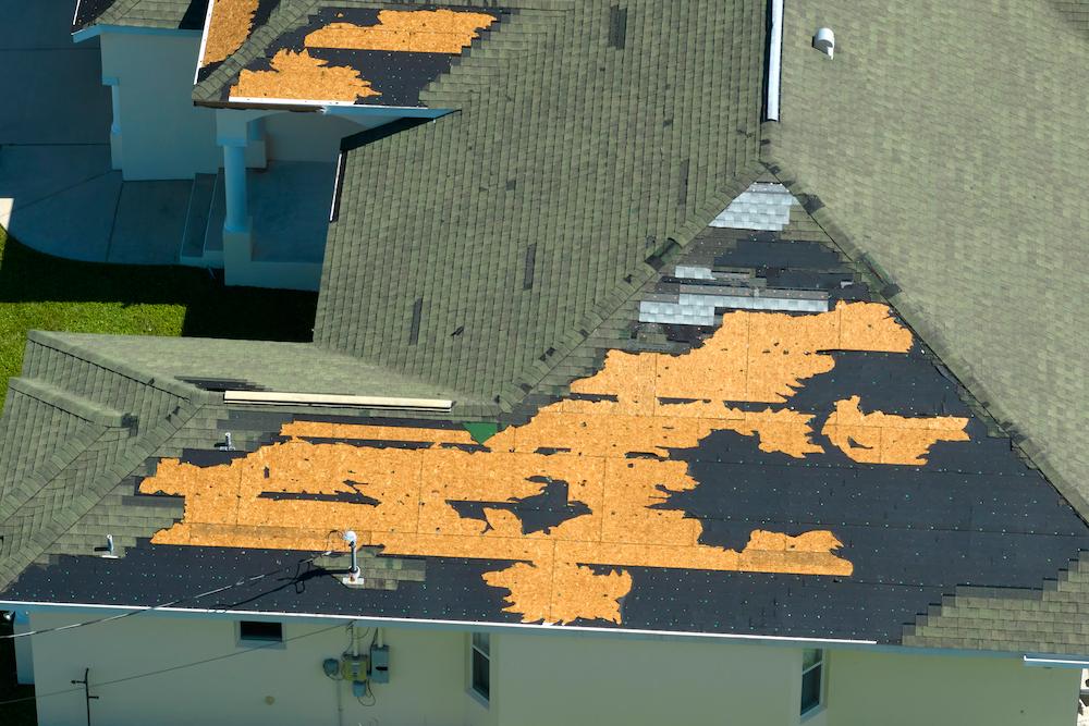 Address Sheridan Storm Damage with help from Beard Roofing & Exteriors image shows damaged roof of house