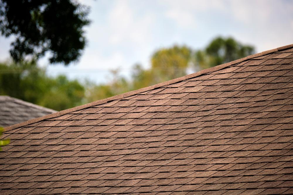 Work with experienced Indianapolis Roofers at Beard Roofing & Exteriors image shows brown shingles of roof