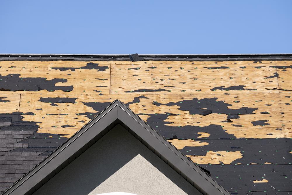 Tackle Roof Hail Damage Indianapolis with help from Beard Roofing & Exteriors image shows roof with damaged shingles