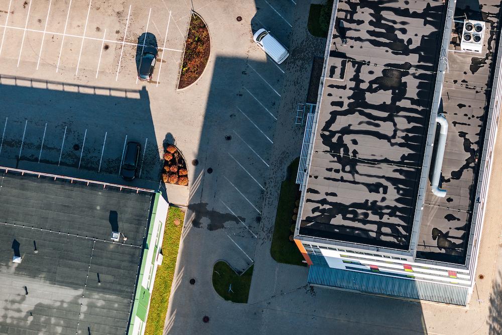 Receive professional Indianapolis Flat Roof Replacement from Beard Roofing & Exteriors image shows two flat rooftops