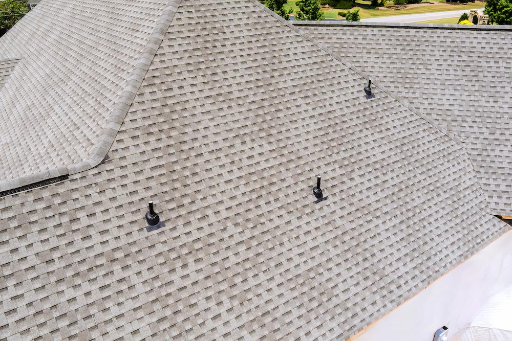 Work with Beard Roofing & Exteriors for a team of expert Zionsville Roofers image shows gray asphalt shingle roofing