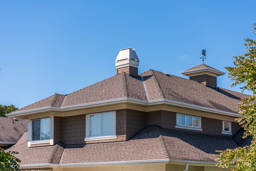 Consider Beard Roofing & Exteriors when comparing Zionsville Roofing Companies image shows roof of home and blue sky